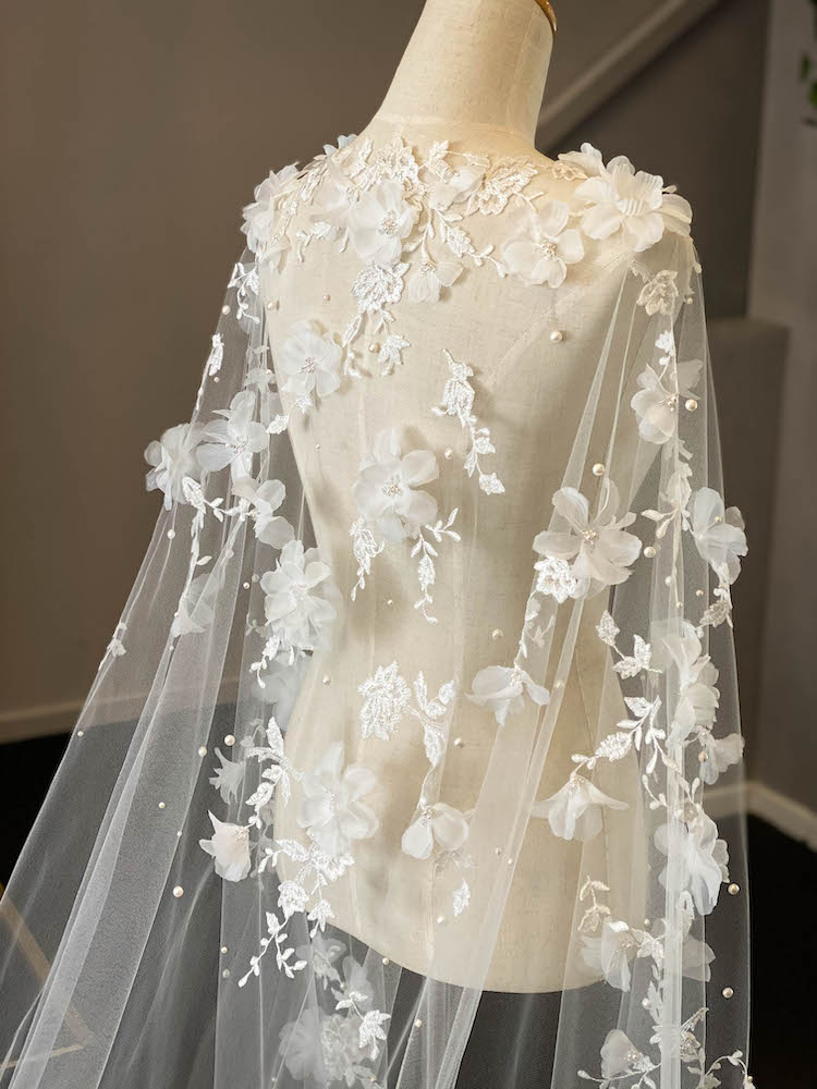 Draped in flowers  A floral lace wedding cape for Alexandra