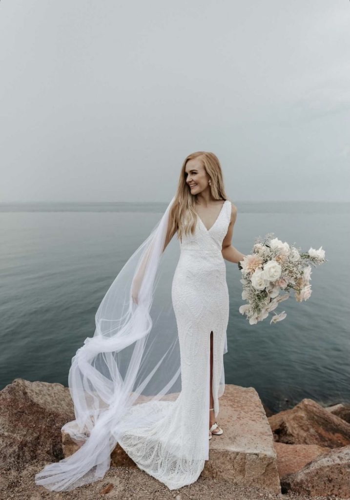 https://www.taniamaras.com/wp-content/uploads/2022/05/Bride-Sophie-wears-the-MARAIS-wedding-veil-1-717x1024-1.jpeg