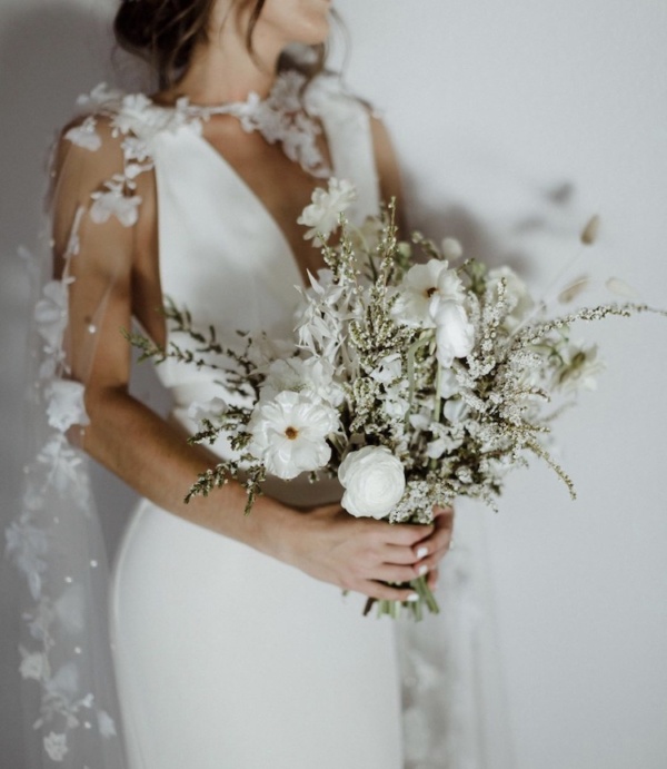 Bride Alex Wears The Draped In Flowers Cape 4.jpg