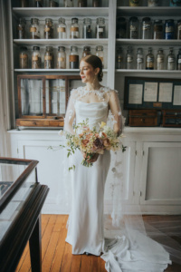 Bride Ali Wears The Draped In Flowers Cape 6.jpg