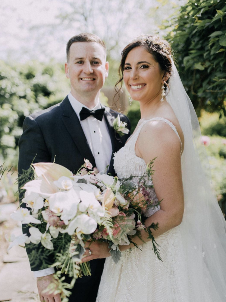 Bride Sophia Wears Cascade Earrings Flores Crown.png